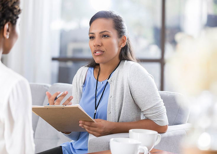 social worker holding clip board