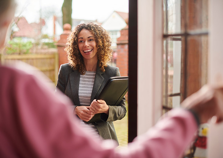 social worker at door to meet clients